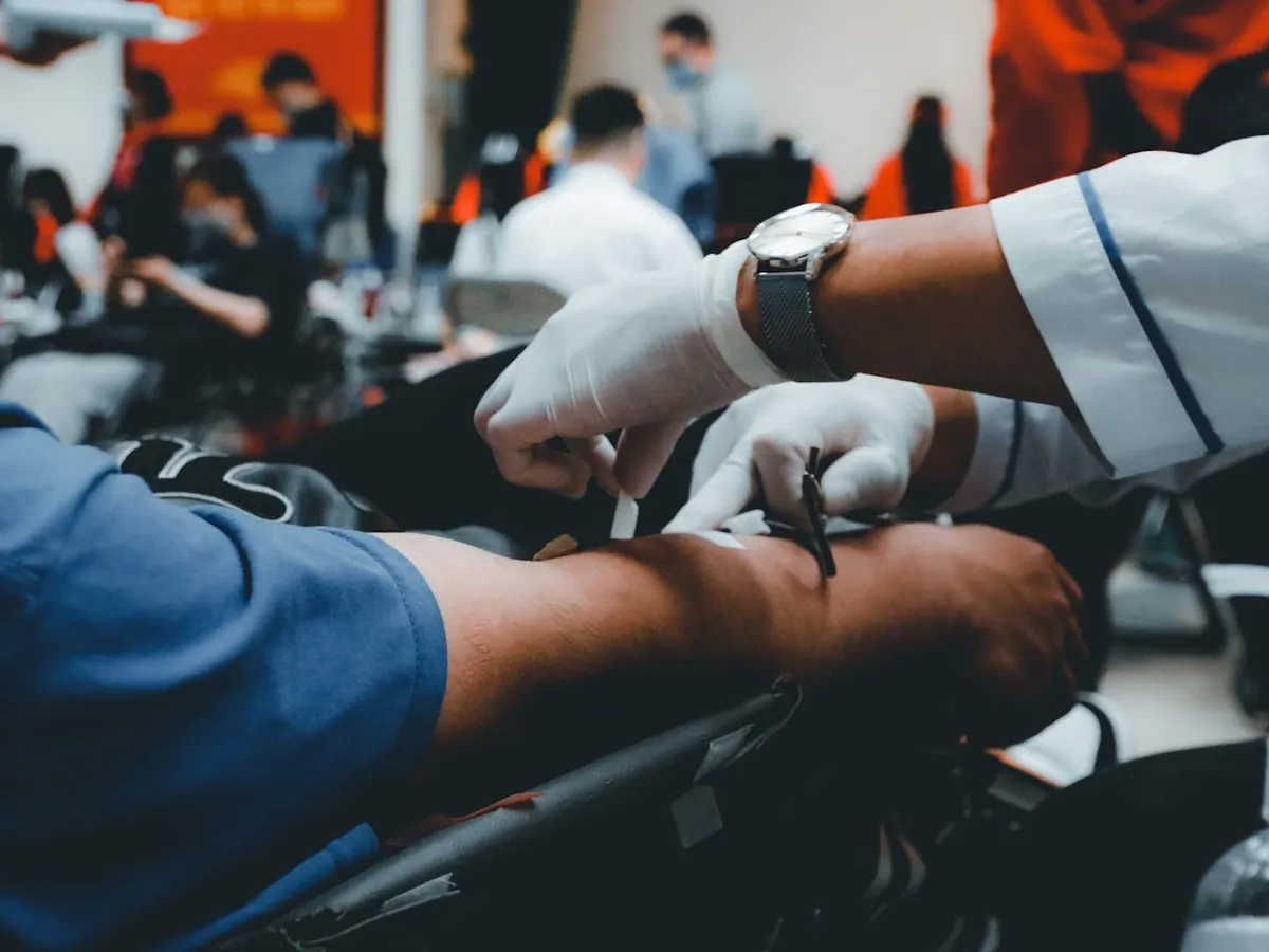 Medical staff attending to donors at a community blood donation camp